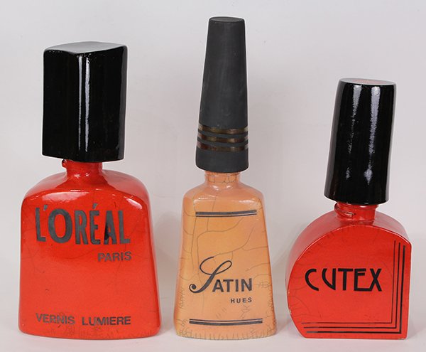 Sculptures by Karen Shapiro: (lot of 3) Karen Shapiro (American, b. 1947), Giant L'Oreal, Satin, and Cutex Nail Polishes, ceramic sculptures, stamped "K" on bottom, largest overall: 18.75"h x 6"w x 6"d.