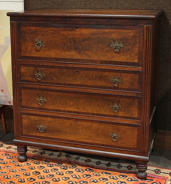 Georgian mahogany butlers desk: Georgian mahogany butlers desk, having a rectangular top above a hinged drawer opening to a fitted interior, above three drawers, and rising on turned bun feet, 46"h x 41.5"w x 23"d