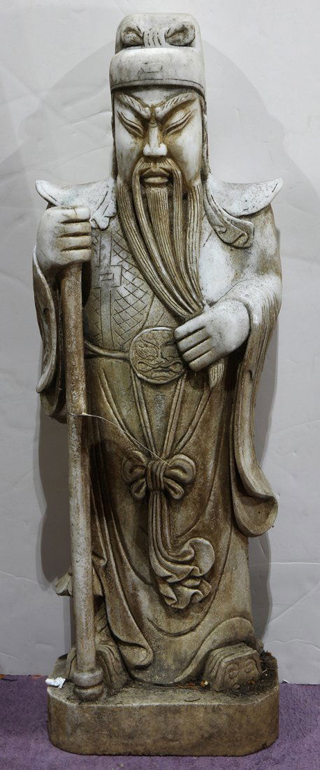 Chinese Stone Guanyu: Chinese stone carving of Guanyu, in characteristic garb and caressing his beard, the right hand with a staff, 37.5"h