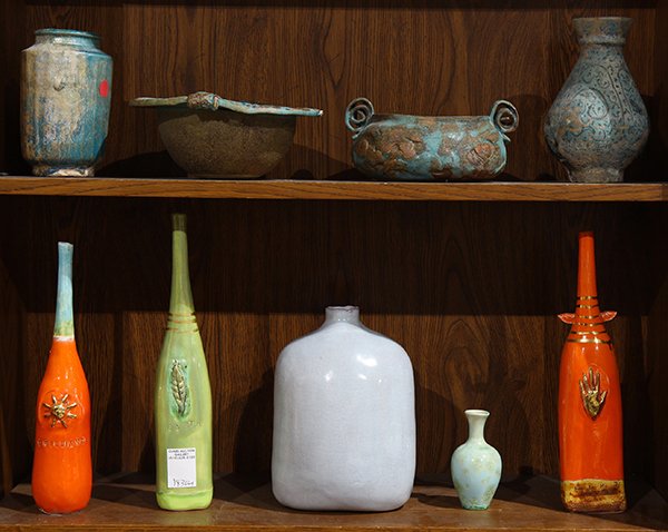 Two shelves of ceramic vessels, including a set of (3) (1 of 1)
