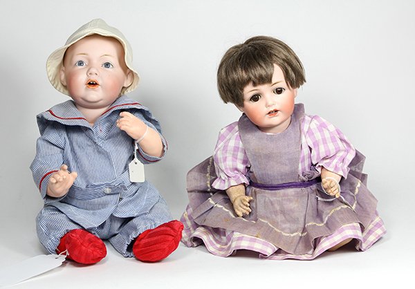 German J.D. Kestner bisque socket head dolls: (lot of 2) German J.D. Kestner character baby dolls consisting of a N. 1010 bisque socket dome head with hand-painted naturalistic and facial details, blue stationary eyes, and an open mouth showing t