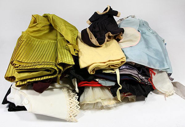 Three shelves of vintage doll clothing, including baby (1 of 3)