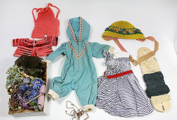 Four shelves of doll accesories and textiles (1 of 5)