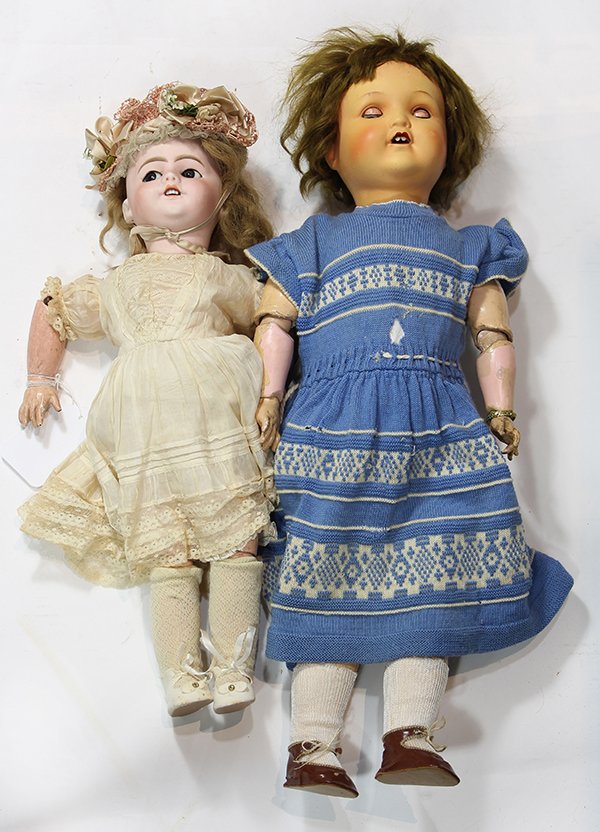German dolls: (lot of 2) French S.F.B.J. bisque socket head doll having a finely hand-decorated face set with brown flirty eyes, pierced ears,e and an open mouth with teeth, on a ball jointed composition body appro