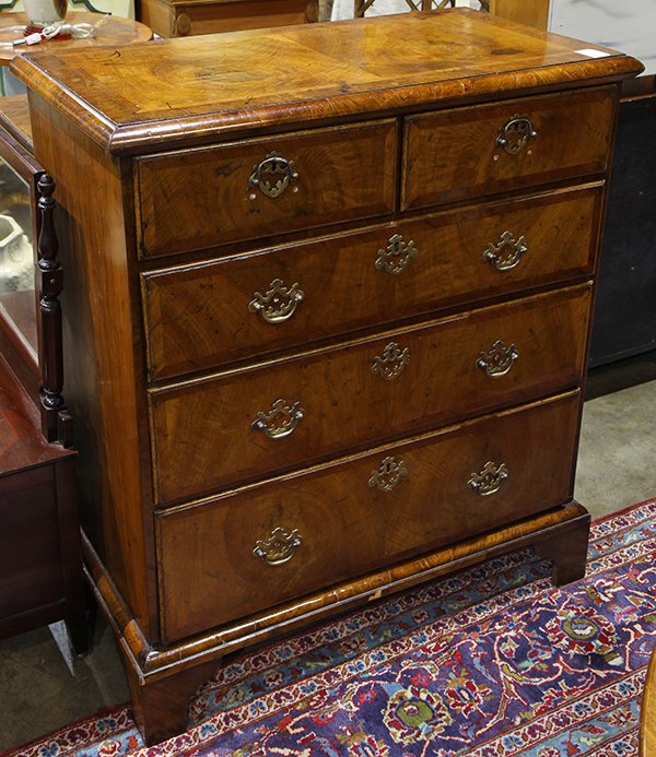 George III marquetry decorated chest of drawers: George III marquetry decorated chest of drawers, the five drawer chest having banded reserves centering the later hardware, and rising on bracket feet, 39"h x 33"w x 17.5"d