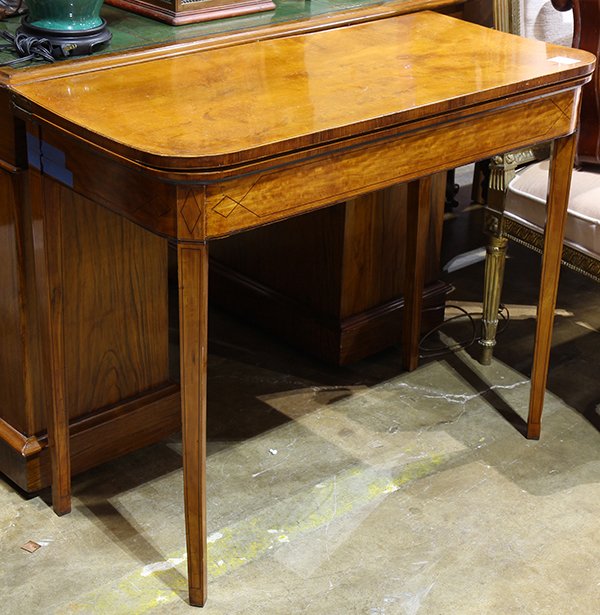 Northern European games table, having a hinged top: Northern European games table, having a hinged top opening to a red lined interior, rising on tapered legs with band inlay, 29.5"h x 35.5"w x 17"d. Provenance: From the Nantucket, MA estate of Richard