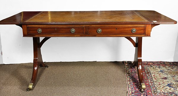 George III style partner's desk: George III style partner's desk, having an embossed leather writing surface, the drop leaf top rising above the two drawer case, surmounting outswept legs terminating on brass casters, 30"h x 67"w x 3