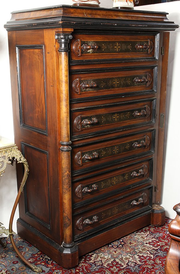 American Victorian partial ebonized side-lock chest: American Victorian partial ebonized side-lock chest, New York, circa 1880, having a rectangular mansard top with ebonized molding above a conforming chest having six drawers centering an appled plaque