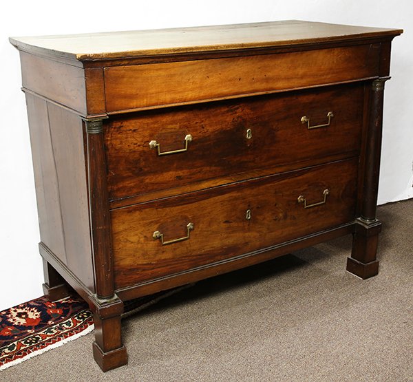 French Directoire commode, circa 1830, executed in: French Directoire commode, circa 1830, executed in walnut, having a rectangular top, above the two drawer case, flanked with columnar pilasters and rising on square feet, 38.5"h x 49"w x 23.5"d
