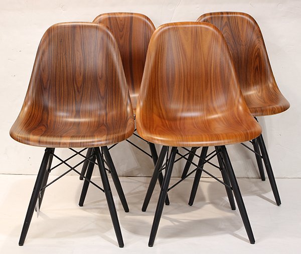 (Lot of 4) Charles Eames for Herman Miller side chairs: (Lot of 4) Charles Eames for Herman Miller side chairs, each having a molded rosewood laminate seat and back, above an Eiffel tower base in ebonized metal, 32"h