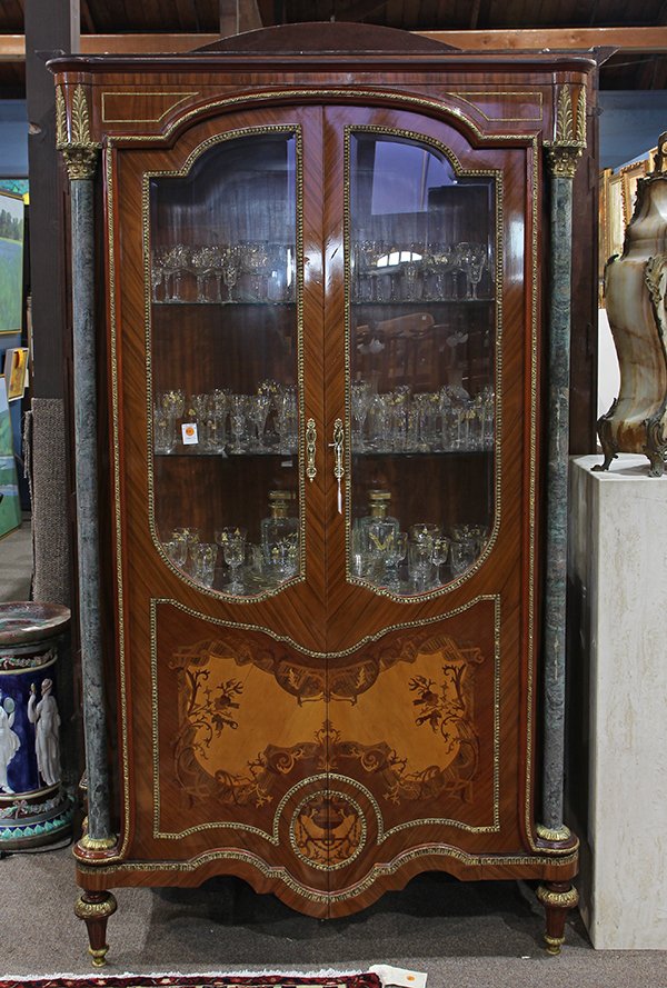 French Neoclassical style ormolu mounted vitrine: French Neoclassical style ormolu mounted vitrine, having green marble columnar pilasters with Corinthian capitals, flanking the inlaid case with two doors having beveled glass panels, opening to two f