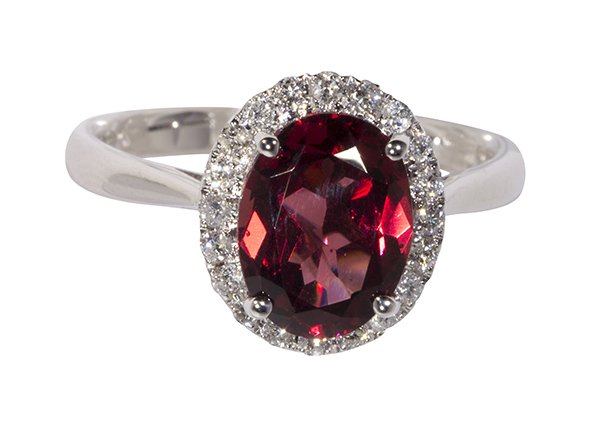 Garnet, diamond and 14k white gold ring: Garnet, diamond and 14k white gold ring centering (1) oval cut garnet weighing approximately 2.46 cts., accented by full cut diamonds weighing in total approximately 0.24 ct., set in a 14k white gold 