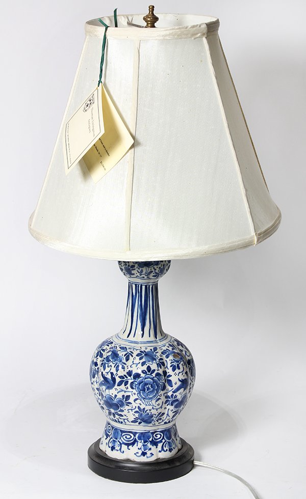 Dutch hand painted vase (now mounted as a lamp): Dutch hand painted vase (now mounted as a lamp), 18th century, the vasiform base having blue hand painted floral sprays on a white ground, and rising on a later circular base, vase 14"h overall 26"h
