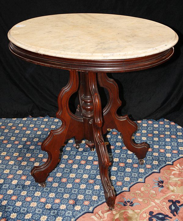 American Victorian marble top occasional table, having (1 of 1)