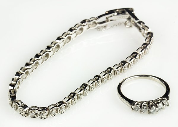(Lot of 2) Diamond, platinum and 14k white gold jewelry: (Lot of 2) diamond, platinum and 14k white gold jewelry items comprised of one platinum ring set with (5) full cut diamonds, totaling approximately 0.40 ct., size 7, together with one 14k white gold b