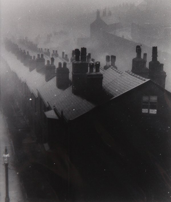 Photograph, Bill Brandt: Bill Brandt (British, 1904-1983), "Misty Evening in Sheffield," 1930/39, gelatin silver print, artist name stamp verso, image: 9"h x 8.75"w, sheet: 10"h x 8"w, overall (with mat): 18"h x 14"w. Provena
