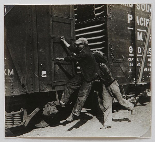Photograph, Walker Evans: Walker Evans (American, 1903-1975) "Men Jumping Train," gelatin silver print, pencil signed verso, image/sheet: 5.5"h x 6.25"w, overall (with mat): 20"h x 16"w