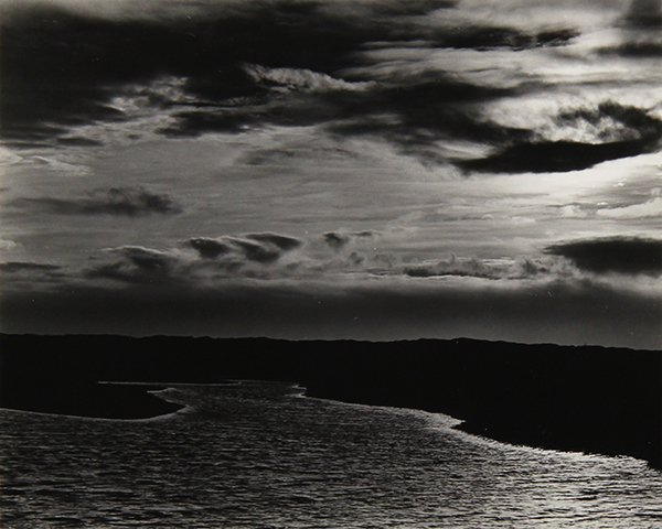 Photograph, Johan Hagemeyer: Johan Hagemeyer (American/Dutch, 1884-1962), "View of an Islet, With Setting Sun," 1940, gelatin silver print, pencil signed and dated lower right, artist stamp verso, image/sheet: 3.75"h x 4.5"w, art