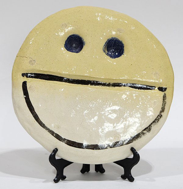 Ceramic sculpture, J.B. Blunk: J.B. Blunk (American, 1926-2003), Smiley Face, glazed painted earthenware plate, overall: 11.25"h x 11.25"w x 1.5"d
