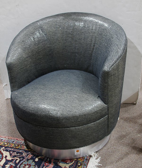 Swivel barrel chair attributed to Milo Baughman: Swivel barrel chair attributed to Milo Baughman, having grey faux-lizard upholstery, and rising on a silver finished base, 31.5"h x 31"w x 22"d
