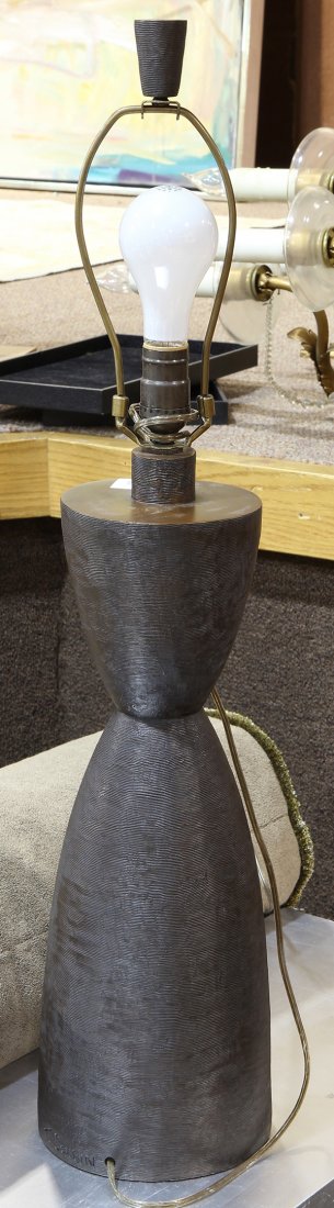 Modern bronze table lamp executed by Tom Corbin: Modern bronze table lamp executed by Tom Corbin, having a stylized hour glass form, with a ribbed pattern, signed at base, 31.5"h