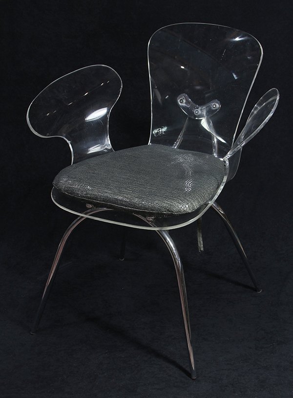 Moderne acrylic chair: Moderne acrylic chair, having outswept arms, with a grey lizard style upholstery and rising on a chrome frame, 31.5"h