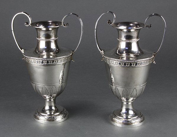 Pair of Continental silver amphora style vases, 37.92: Pair of Continental silver amphora style vases, each set with a flaring neck above stylized bands and beaded accents, 10"h, 37.92 troy oz., (acid test held for .800 silver)