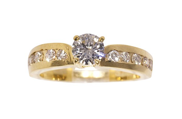 Diamond and 18k yellow gold ring: Diamond and 18k yellow gold ring centering (1) round brilliant cut diamond weighing approximately 0.46 ct., accented by (10) full cut diamonds weighing a total of approximately 0.35 ct., set in an 18k
