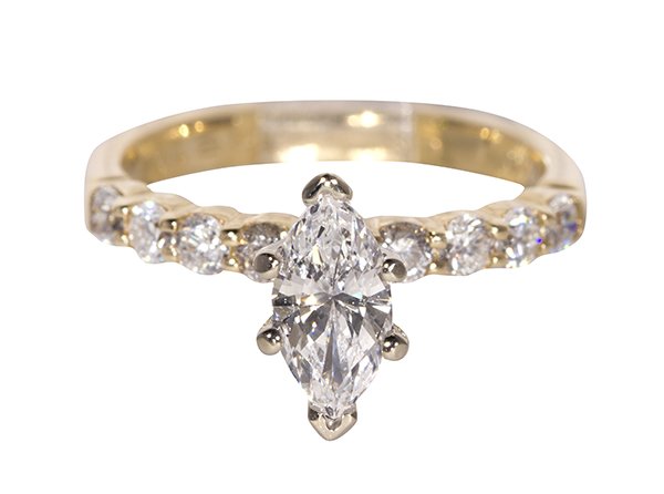 Diamond and 14k yellow gold ring: Diamond and 14k yellow gold ring centering (1) marquise cut diamond weighing approximately 0.69 ct., accented by (8) full cut diamonds weighing a total of approximately 0.40 ct., set in a 14k yellow g