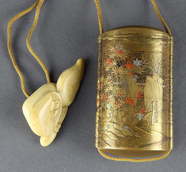 Japanese Netsuke and Inro: Japanese gilt lacquered four-tier inro, exterior decorated with maple leaves, clouds in takamakie, interior in orange/copper colored nashiji with a bone netsuke in the shape of three shells, from one