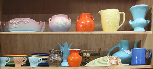 Four shelves of  American pottery, with examples by (1 of 2)