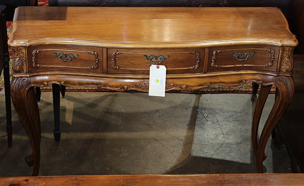 Louis XV style sideboard, circa 1890, having a shaped: Louis XV style sideboard, circa 1890, having a shaped top, above three drawers, and rising on cabriole legs, 32"h x 46"w x 14.5"d