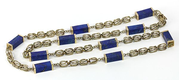 Lapis lazuli and 10k yellow gold necklace: Lapis lazuli and 10k yellow gold necklace featuring (10) rectangular lapis lazuli columns measuring approximately 18 x 7 x 7 mm, each capped and interspaced by 10k yellow gold wire twist fancy links,