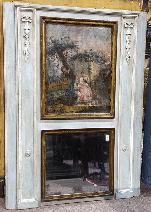 French Louis XVI style trumeau mirror: French Louis XVI style trumeau mirror, 19th century, having a partial gilt and polychrome decorated molding flanking the looking glass surmounted with the hand painted scenic panel, depicting a courti