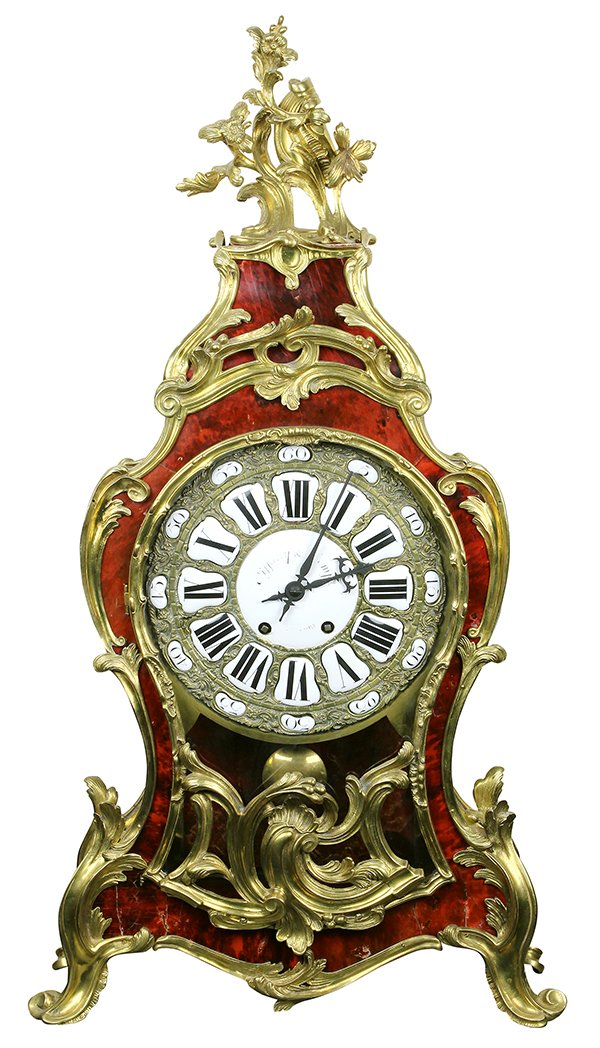 French Louis XV style ormolu mounted mantle clock: French Louis XV style ormolu mounted mantle clock retailed by Tiffany and Co., New York, the gilt bronze mounted case having a single window showing the raised enamel Roman markers, Tiffany and Compan