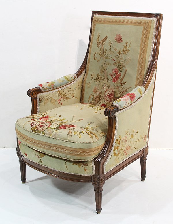 (lot of 2) Louis XVI associated bergeres: (lot of 2) Louis XVI associated bergeres,18th century, each having a needlepoint upholstered seat and back, and rising on fluted and tapered legs, 36.5"h (repairs to rear legs)