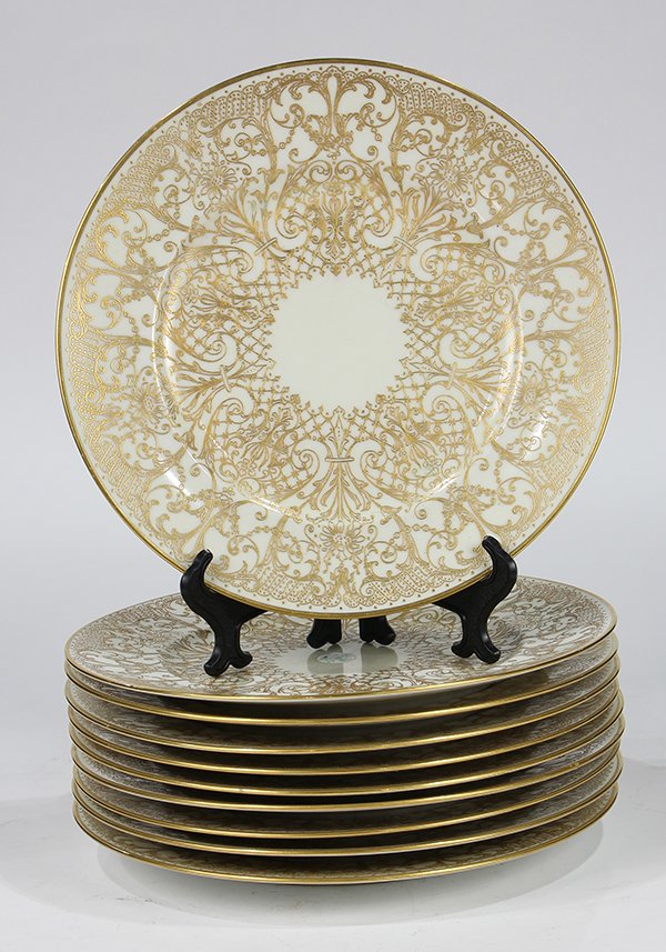 Parcel gilt porcelain chargers by Royal Bavarian: (lot of 10) Parcel gilt porcelain chargers by Royal Bavarian Hutschenreuther in the Favorite pattern, having a Rococo style scrolling trellis pattern executed in raised gilt, 10.5"dia