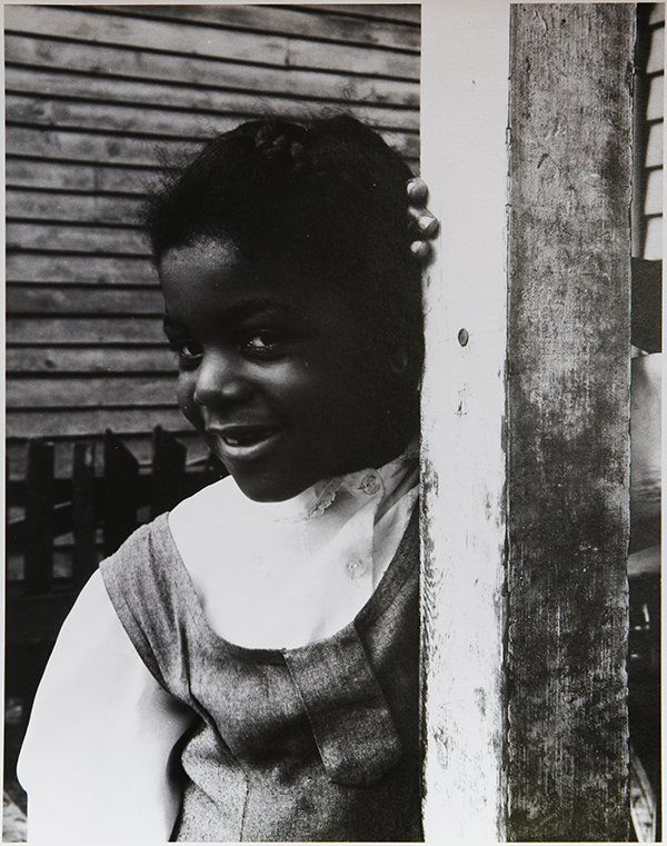 Photograph, Meatyard: Ralph Eugene Meatyard (American, 1925-1972), Untitled (Little Girl Smiling), gelatin silver print, signed "Madelyn O. Meatyard" verso, image: 9.75"h x 7.5"w, sheet: 10"h x 8"w, overall (with mat): 20"