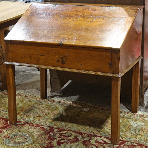Continental slant front desk: Continental slant front desk, 19th century, the hinged top opening to a fitted interior, and rising on square legs, 35"h x 36"w x 24"d