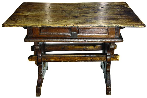 Italian Gothic Revival walnut lift top trestle table: Italian Gothic Revival walnut lift top trestle table, having some earlier elements, the rectangular top above a trestle base with carved supports having trefoil accents, Provenance: Property from the 