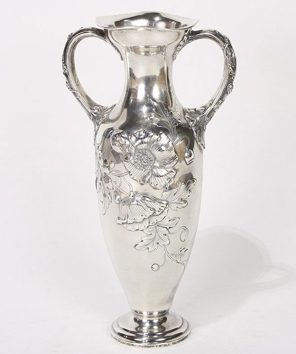 Gorham Art Nouveau sterling silver amphora style vase,: Gorham Art Nouveau sterling silver amphora style vase decorated with repousse flowers on a polished ground, the shouldered form set with a stick neck, free form rim, and flanked by handles with confor