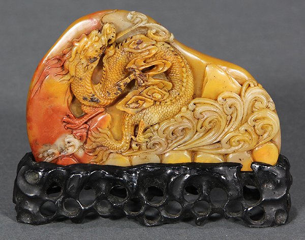 Chinese Soapstone Seal, Dragon: Chinese soapstone seal, featuring a dragon emerging from the sea, executed from a russet and honey colored matrix, with stand, seal: 3.75"w