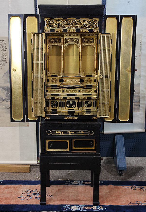 Japanese Large Gilt/Black Lacquered Buddhist Altar: Japanese gilt and black lacquered butsudan (Buddhist altar), consisting of three separate sections, a removable panel on top, underneath electrified to light the interior, exterior black lacquered dou
