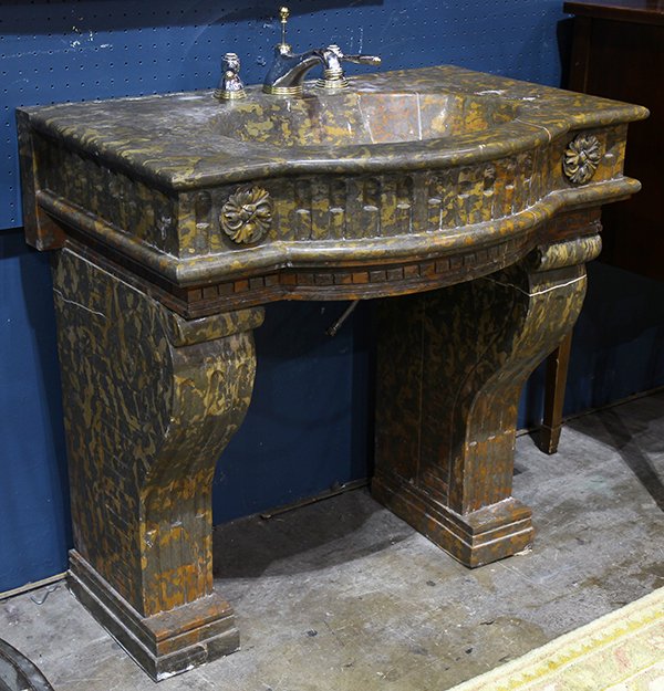 Moderne marble sink with fixtures: Moderne marble sink with fixtures, the top accented with rosette medallions, above the shaped supports have scrolled decoration, 34"h x 34"w x 22"d