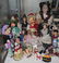 (lot of 40) One shelf of dolls, executed in cloth,