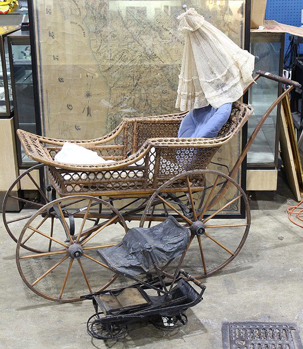 antique wicker baby carriage with parasol