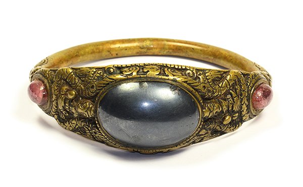 Hematite, tourmaline and bronze armlet: Hematite, tourmaline and bronze armlet centering one oval hematite cabochon measuring approximately 42.2 x 28.6 mm, flanked by (2) oval pink tourmaline cabochons measuring approximately 14.3 x 10.9 mm