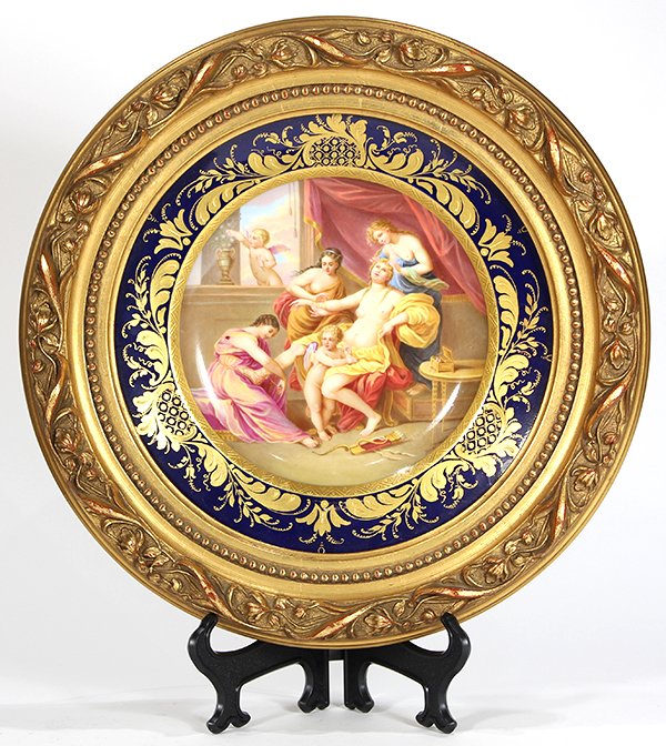 Framed Royal Vienna cabinet plate: Framed Royal Vienna cabinet plate, depicting a Classical scene of the nude Venus with Cupid, flanked by the partial nude attendants, surrounded by the cobalt border accented with raised gilt accents, 