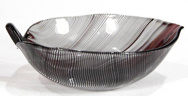 Venini art glass bowl: Venini art glass bowl, by Tyra Lundgren, circa 1940, having a leaf form with mezza filigrana in aubergine on a clear ground, underside marked "Venini, Murano, Italia", 1.5"h x 4.5"w