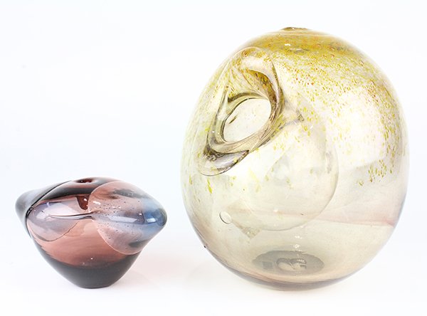 (Lot of 2) Jim Wayne art glass vessels: (Lot of 2) Jim Wayne art glass vessels, 20th century, including a bulbous glass vessel decorated with mottled yellow accents on a smokey glass ground, together with a triangular formed vase executed i